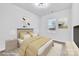 This staged bedroom features a light neutral color palette and plenty of natural light at 2867 W Zion Church Rd, Shelby, NC 28150
