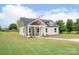 Charming home featuring a covered porch, manicured lawn, and eye-catching exterior color scheme at 2867 W Zion Church Rd, Shelby, NC 28150