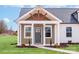 The home's inviting porch is framed by elegant columns and windows, and has the house number above the door at 2867 W Zion Church Rd, Shelby, NC 28150