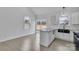 Kitchen island featuring granite countertops, bright white cabinets, and a view to the backyard at 2867 W Zion Church Rd, Shelby, NC 28150