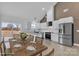 Well-appointed kitchen with stainless steel appliances, white cabinetry, and a functional island with marble backsplash at 2867 W Zion Church Rd, Shelby, NC 28150