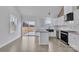 Kitchen features modern appliances, granite countertops, and a view to the backyard at 2867 W Zion Church Rd, Shelby, NC 28150