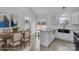 Bright kitchen with modern white cabinetry, stainless steel appliances, an island, and seamless access to backyard at 2867 W Zion Church Rd, Shelby, NC 28150