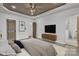 Spacious primary bedroom with a tray ceiling, modern design, and access to an en-suite bathroom for convenience at 2867 W Zion Church Rd, Shelby, NC 28150