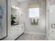 Clean bathroom featuring a vanity, granite countertops, a large mirror and tiled floors at 3020 Finchborough Ct # 230, Charlotte, NC 28269
