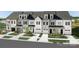 Charming townhome exteriors with well-manicured lawns, driveways and black accent roofing at 3020 Finchborough Ct # 230, Charlotte, NC 28269