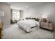 Serene main bedroom featuring a large bed, soft lighting, and neutral tones at 3020 Finchborough Ct # 230, Charlotte, NC 28269