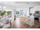 Bright, open kitchen featuring stainless steel appliances, center island with bar seating, and an eat-in breakfast nook at 3158 Finchborough Ct # 256, Charlotte, NC 28269