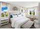 Serene primary bedroom with ample natural light, stylish furnishings, and a cozy sitting area at 3158 Finchborough Ct # 256, Charlotte, NC 28269