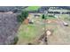 Aerial view of a large property featuring a barn, pastures, a home, and a pond at 3427 Joe Johnson Rd, Catawba, NC 28609