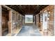 Spacious barn interior with multiple stalls, gravel flooring, and good lighting at 3427 Joe Johnson Rd, Catawba, NC 28609