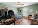 Green bedroom with a single bed, desk, and lots of natural light through the windows at 3427 Joe Johnson Rd, Catawba, NC 28609