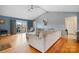 Open-concept living room with vaulted ceiling, hardwood floors, and seamless access to the backyard at 3427 Joe Johnson Rd, Catawba, NC 28609