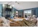 Inviting living room featuring a stone fireplace, vaulted ceiling, and access to outdoor deck at 3427 Joe Johnson Rd, Catawba, NC 28609