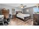 Comfortable main bedroom with hardwood floors, ceiling fan, and large windows for natural light at 3427 Joe Johnson Rd, Catawba, NC 28609