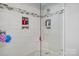 Modern walk-in shower with glass enclosure and recessed shelving for toiletries at 3427 Joe Johnson Rd, Catawba, NC 28609