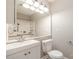 Well-lit bathroom with a large mirror, modern sink, toilet, and shower at 3610 Melrose Cottage Dr, Matthews, NC 28105
