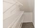 Angled closet with multiple white shelves, perfect for organizing all of your belongings at 3610 Melrose Cottage Dr, Matthews, NC 28105