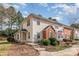 Charming townhome with a landscaped front yard, brick accent, and inviting entrance at 3610 Melrose Cottage Dr, Matthews, NC 28105
