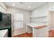 Cozy kitchen nook with built-in desk and modern stainless steel refrigerator at 3610 Melrose Cottage Dr, Matthews, NC 28105