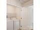 Convenient laundry area featuring a washer and dryer, with a door leading to other rooms at 3610 Melrose Cottage Dr, Matthews, NC 28105