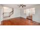 Bright living room with hardwood floors and staircase leading to the upper level at 3610 Melrose Cottage Dr, Matthews, NC 28105