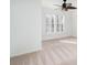 Bright bedroom featuring plantation shutters on the windows and a ceiling fan at 3822 Carl Parmer Dr, Harrisburg, NC 28075