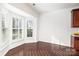 Bright breakfast nook with wood floors and white plantation shutters at 3822 Carl Parmer Dr, Harrisburg, NC 28075