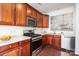 This open kitchen features wood cabinets, stainless steel appliances, and marble countertops at 3822 Carl Parmer Dr, Harrisburg, NC 28075
