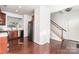 This open kitchen connects to the breakfast nook and features a stainless steel refrigerator and a stairway at 3822 Carl Parmer Dr, Harrisburg, NC 28075