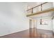 Open living room with wood floors and a staircase at 3822 Carl Parmer Dr, Harrisburg, NC 28075