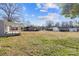 Large backyard with green grass, multiple buildings, and ample space for outdoor activities at 41 Fleetwood Sw Dr # 44, Concord, NC 28027