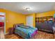 Bedroom featuring yellow walls, wood-look floors, two windows and a closet at 41 Fleetwood Sw Dr # 44, Concord, NC 28027