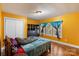 Bedroom featuring yellow walls, wood-look floors, two windows and a closet at 41 Fleetwood Sw Dr # 44, Concord, NC 28027