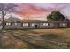 Charming one-story home featuring a landscaped yard and inviting facade under a colorful sunset at 41 Fleetwood Sw Dr # 44, Concord, NC 28027