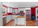 Bright kitchen with white cabinets, stainless steel appliances, and a butcher block island at 41 Fleetwood Sw Dr # 44, Concord, NC 28027