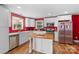 Bright kitchen with white cabinets, stainless steel appliances, and a butcher block island at 41 Fleetwood Sw Dr # 44, Concord, NC 28027