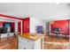 Open layout kitchen with stainless steel appliances and a wooden island at 41 Fleetwood Sw Dr # 44, Concord, NC 28027