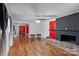 Open living room design features wood floors and a brick fireplace at 41 Fleetwood Sw Dr # 44, Concord, NC 28027