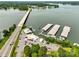 Expansive aerial view of a lake community featuring a marina, bridge, and waterfront access at 416 Clemson Tree Ln, Lake Wylie, SC 29710