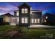 Expansive backyard with a screened porch and concrete patio, perfect for outdoor entertaining at 416 Clemson Tree Ln, Lake Wylie, SC 29710