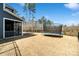 The spacious backyard features a trampoline and a fence, creating a safe outdoor space at 416 Clemson Tree Ln, Lake Wylie, SC 29710