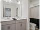 Bathroom featuring a double vanity, large mirror, and toilet with shower behind at 416 Clemson Tree Ln, Lake Wylie, SC 29710