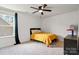 Bedroom features carpet, a window with curtains, a ceiling fan, and neutral decor at 416 Clemson Tree Ln, Lake Wylie, SC 29710