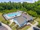 Aerial view of a community pool, showcasing lounge chairs, a splash area, and landscaped grounds at 416 Clemson Tree Ln, Lake Wylie, SC 29710