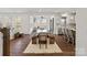 Open-concept dining area with large windows and contemporary lighting at 416 Clemson Tree Ln, Lake Wylie, SC 29710