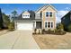 Inviting two-story home featuring a two-car garage and well-maintained landscaping at 416 Clemson Tree Ln, Lake Wylie, SC 29710