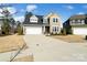 Charming two-story home featuring a two-car garage and manicured front lawn at 416 Clemson Tree Ln, Lake Wylie, SC 29710