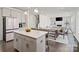 Eat-in kitchen flows into the living area; a large island provides counter seating at 416 Clemson Tree Ln, Lake Wylie, SC 29710