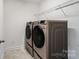 Convenient laundry area featuring modern washer and dryer with smart technology at 416 Clemson Tree Ln, Lake Wylie, SC 29710